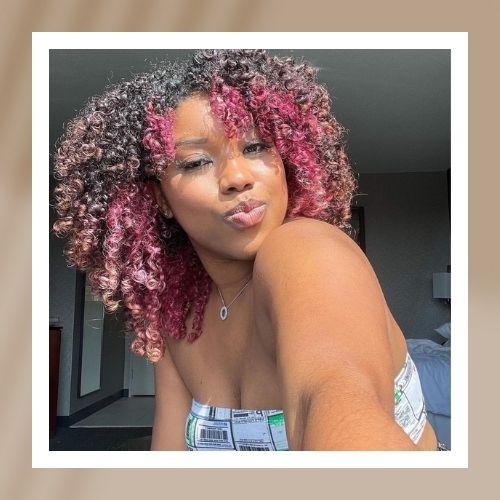 Curly Hair with Pink Highlights