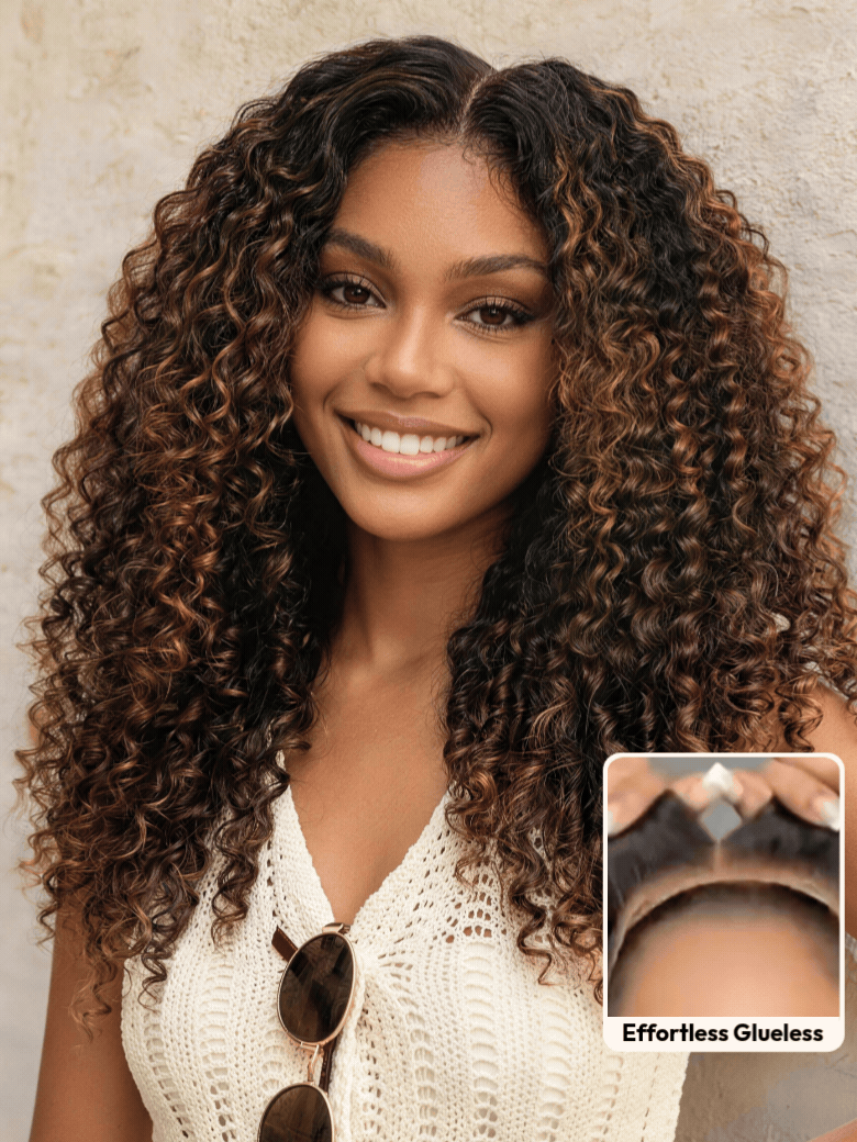 A smiling woman with long, voluminous, curly hair and subtle highlights wears a sleeveless knit top. An inset shows a close-up of her scalp with the realistic hairline of the brown highlight wig labeled “Invisiknots & Glueless.”.
