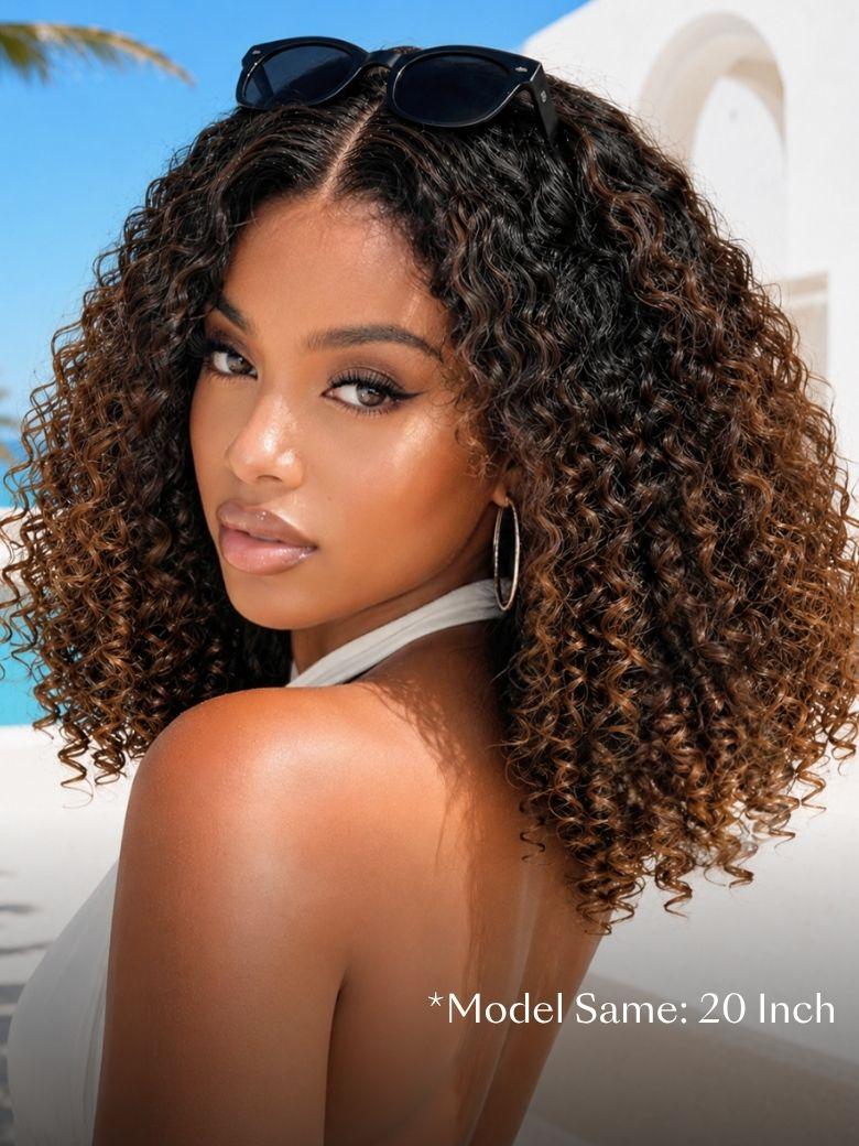 A smiling woman with long, voluminous, curly hair and subtle highlights wears a sleeveless knit top. An inset shows a close-up of her scalp with the realistic hairline of the brown highlight wig labeled “Invisiknots & Glueless.”.
