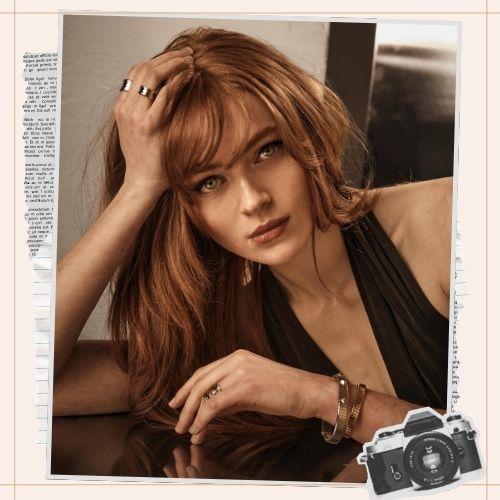 Sadie Sink red hair with curtain bangs and long waves