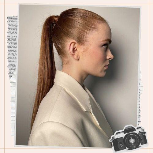 Sadie Sink sleek high ponytail in copper red hair color