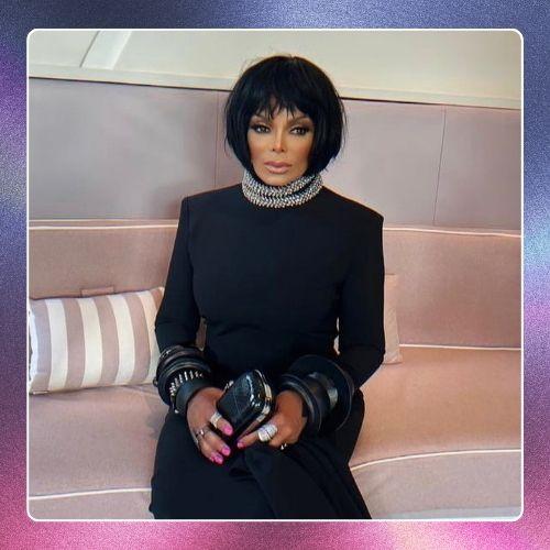 Janet Jackson with a sleek black short bob haircut and bangs