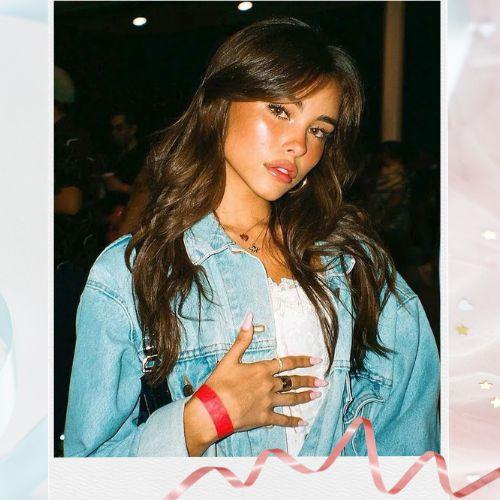Madison Beer with long layered hair and soft curtain bangs framing her face