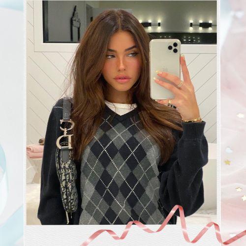 Madison Beer with signature chocolate brown hair styled in glossy loose waves