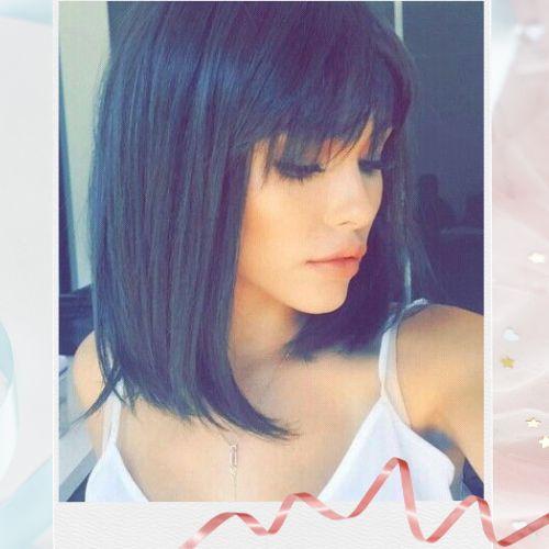 Madison Beer with a chic short bob hairstyle and full bangs
