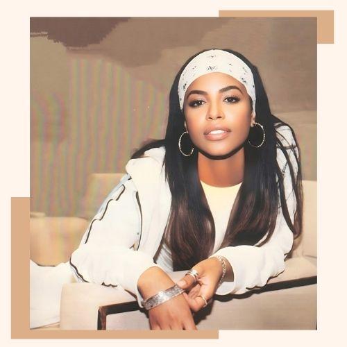 Aaliyah 90s street style dark straight hair styled with a patterned headband