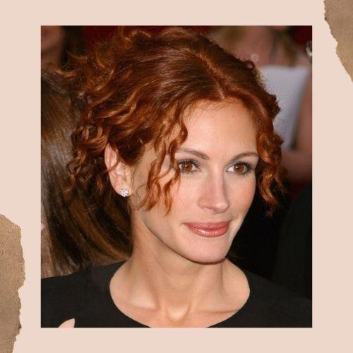 Julia Roberts with stylized red curly hair framed around her face