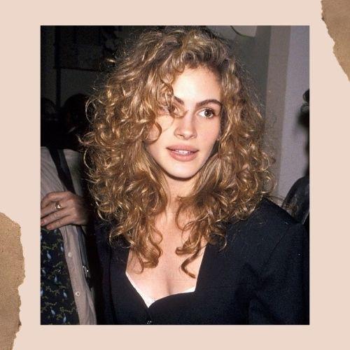 Young Julia Roberts with her iconic voluminous blonde curly hair