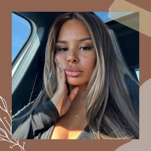 Long sleek straight dark brown hair with icy blonde ribbon highlights