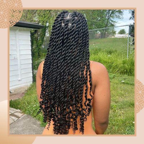 Long two-strand twists protective hairstyle featuring voluminous curly ends