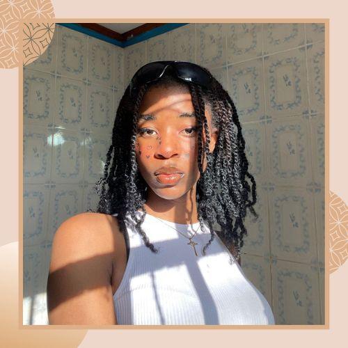Shoulder-length mini twists hairstyle on natural black hair