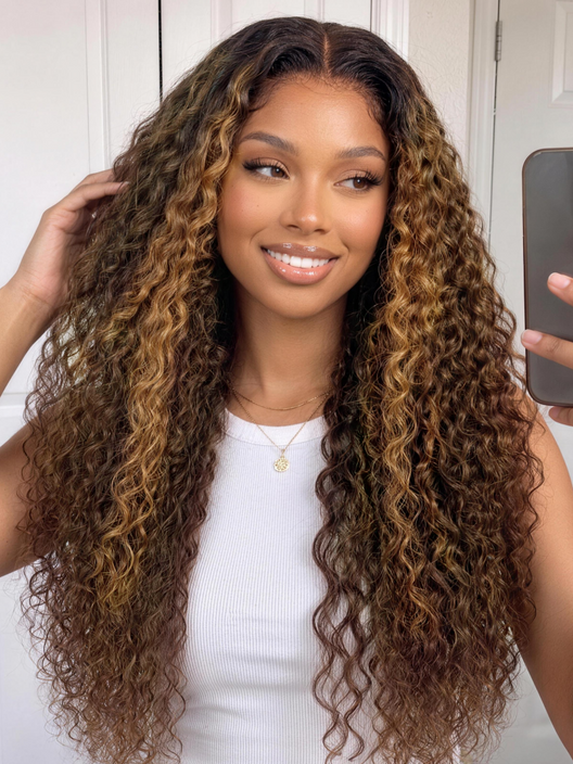 Woman taking a mirror selfie while wearing a brown water wave wig with blonde highlights