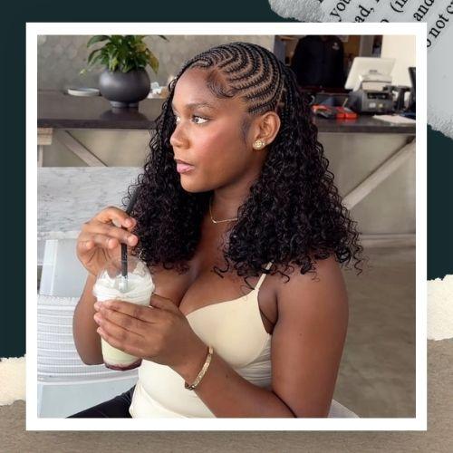 A woman featuring cornrows at the top flowing into voluminous loose curls.