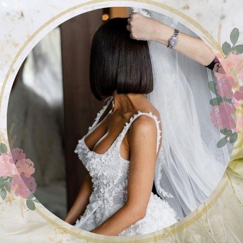Chic short blunt bob wedding hairstyle for black hair with bridal veil