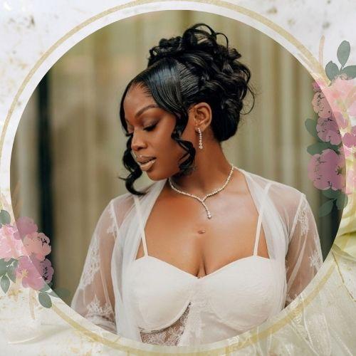 Romantic braided updo wedding hairstyle for black women with loose face-framing curls
