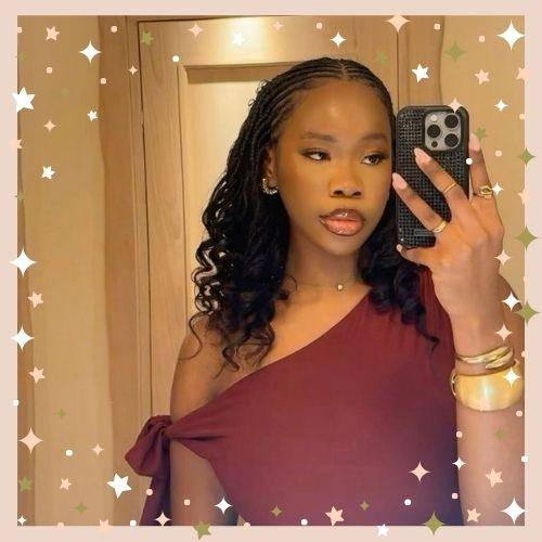 Half Fulani braids half sew-in protective hairstyle with deep curly weave
