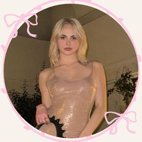 Adela Jergova with bleached blonde platinum shoulder-length wavy hair