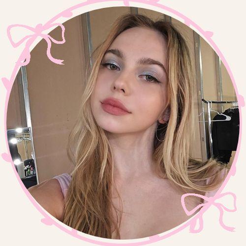 Adela Jergova with warm honey blonde long wavy hair