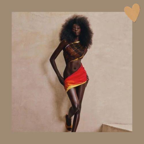 Anok Yai with voluminous big hair full-body portrait