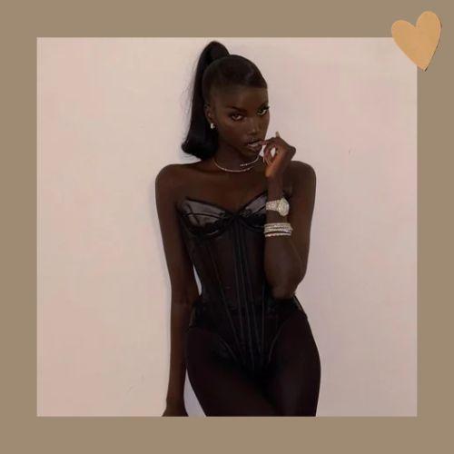 Anok Yai styled in a high sleek Barbie ponytail
