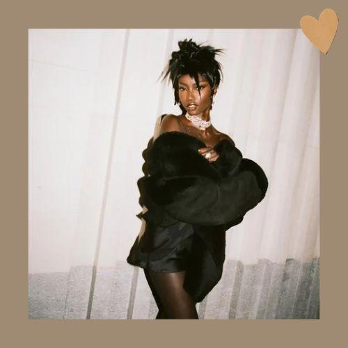 Anok Yai wearing a Y2K style spiky messy bun