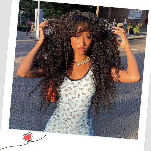 Voluminous curly weave hairstyles with bangs and a lace closure